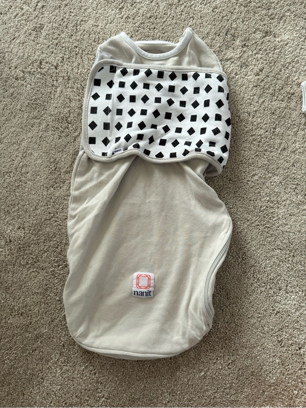 Nanit Neutral Beige Baby Sleep Swaddle with Black Patterned Accent
